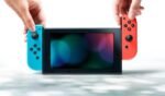 Consola Nintendo Switch negra con mandos Joy-Con derecho de color rojo neón - Imagen 4